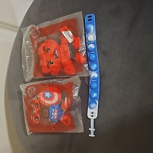 Captain America, Red Hulk, blue pop-it bracelet, and blue lantern